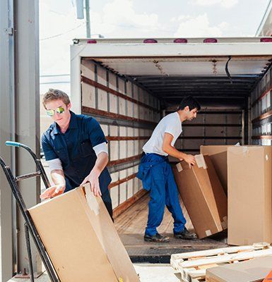 Vending Machine Delivery — Workers Loading a Delivery Truck in Jefferson, LA Vending Machine Delivery — Workers Loading a Delivery Truck in Jefferson, LA