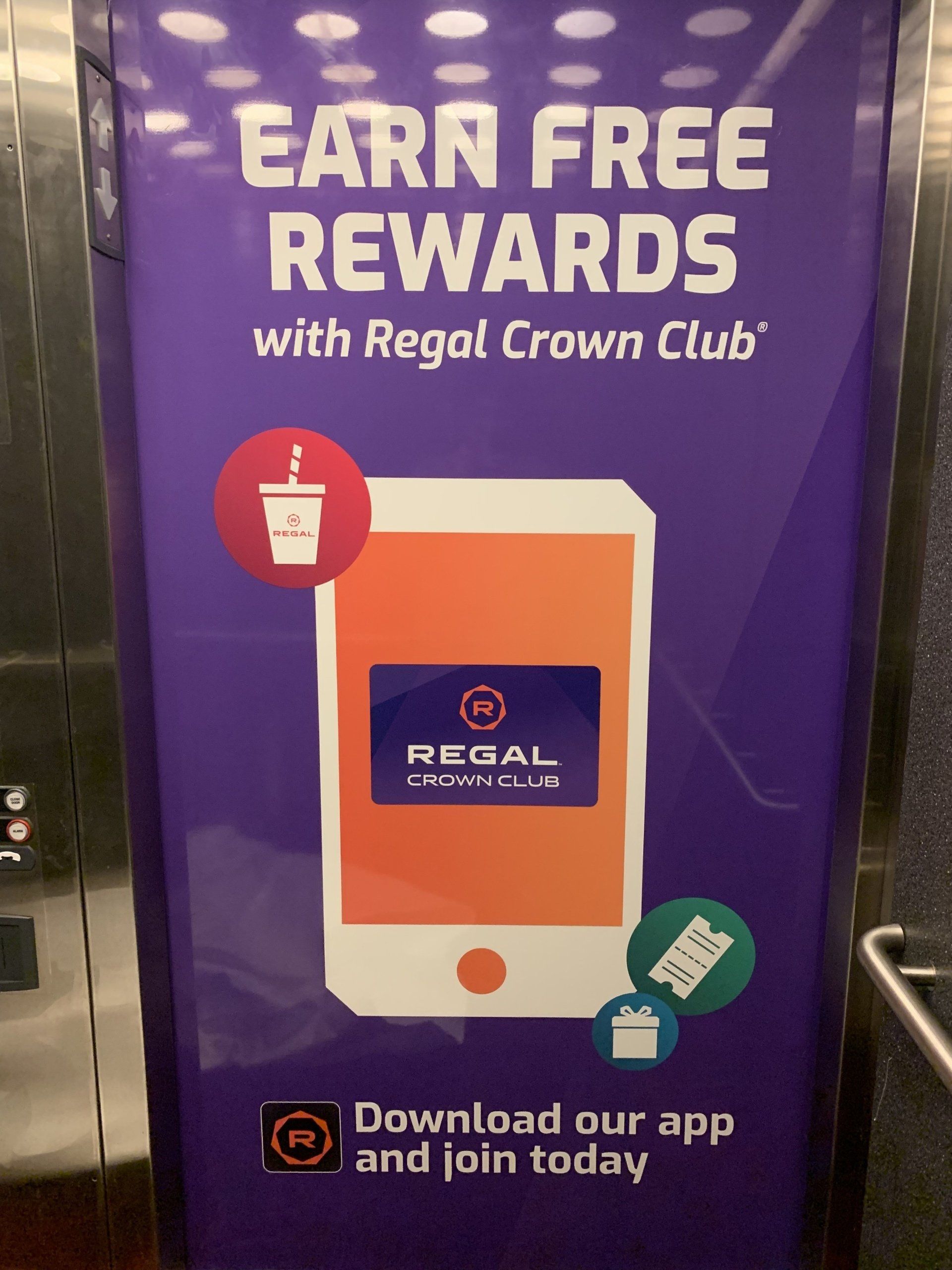 Poster promoting Regal Crown Club rewards, with a purple background and a phone graphic.