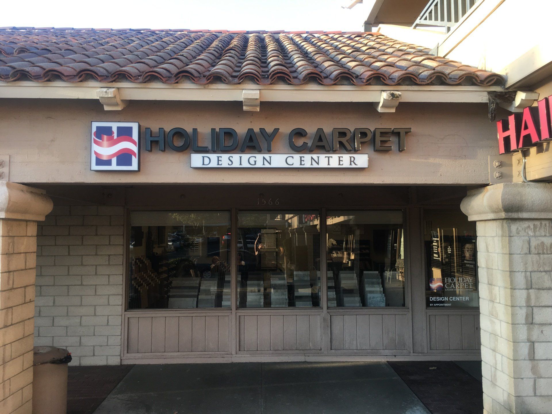 Holiday Market Design Center storefront with stone arches and glass entrance