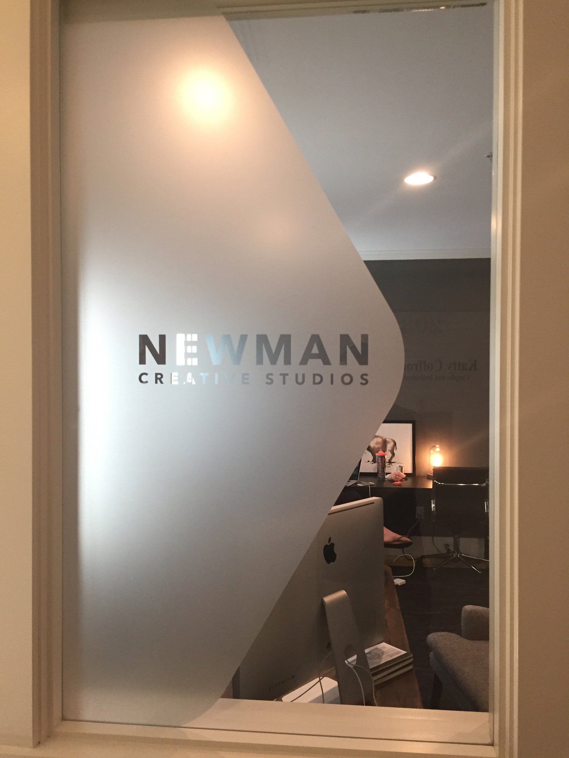 newman design studios door decal