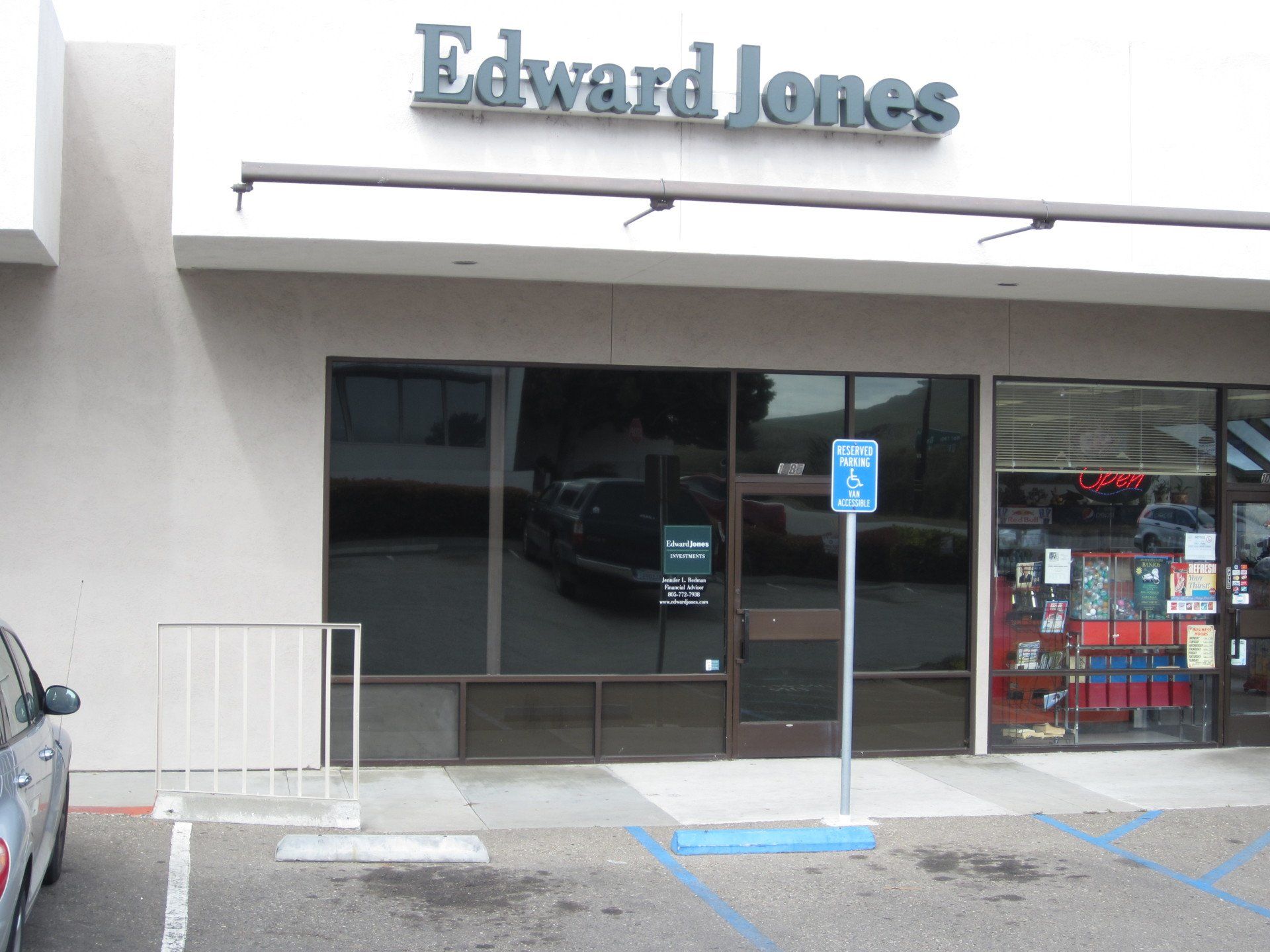 Edward Jones storefront with accessible parking sign and glass windows