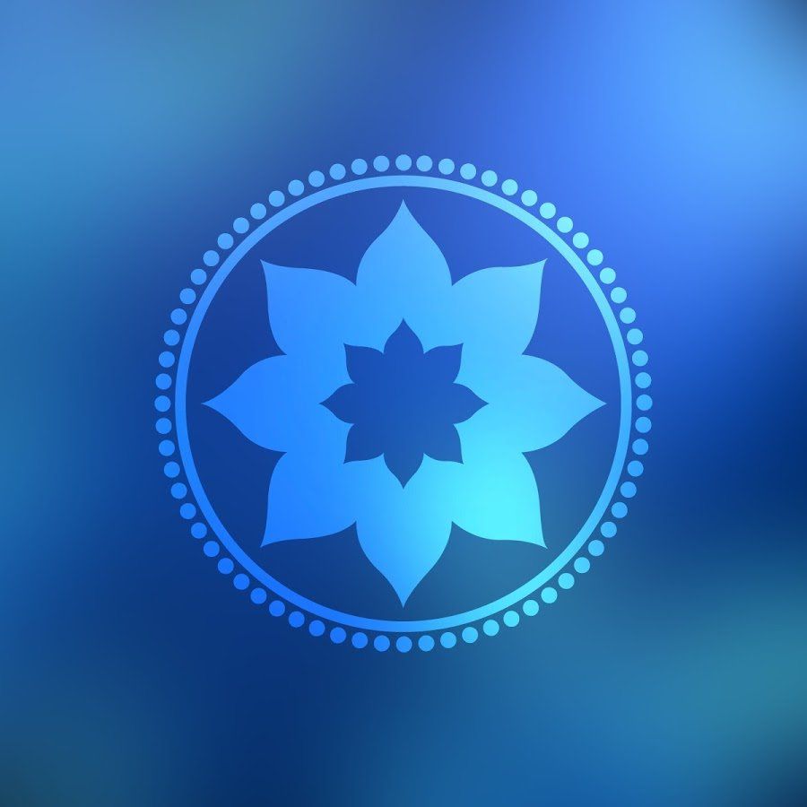 Blue floral mandala emblem with a dotted ring on a blurred blue gradient background