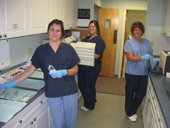 staff prepping to perform oral surgery