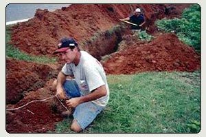 Sewer and Water Mains — Workers Installing Water Main in Shelby, NC