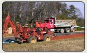 Trucks and Bulldozer — Truck and Bulldozer used to Installing Water Mains in Shelby, NC Trucks and Bulldozer — Truck and Bulldozer used to Installing Water Mains in Shelby, NC