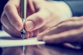 Man writing a note - Personal Injury Attorney in Long Branch, NJ Man writing a note - Personal Injury Attorney in Long Branch, NJ