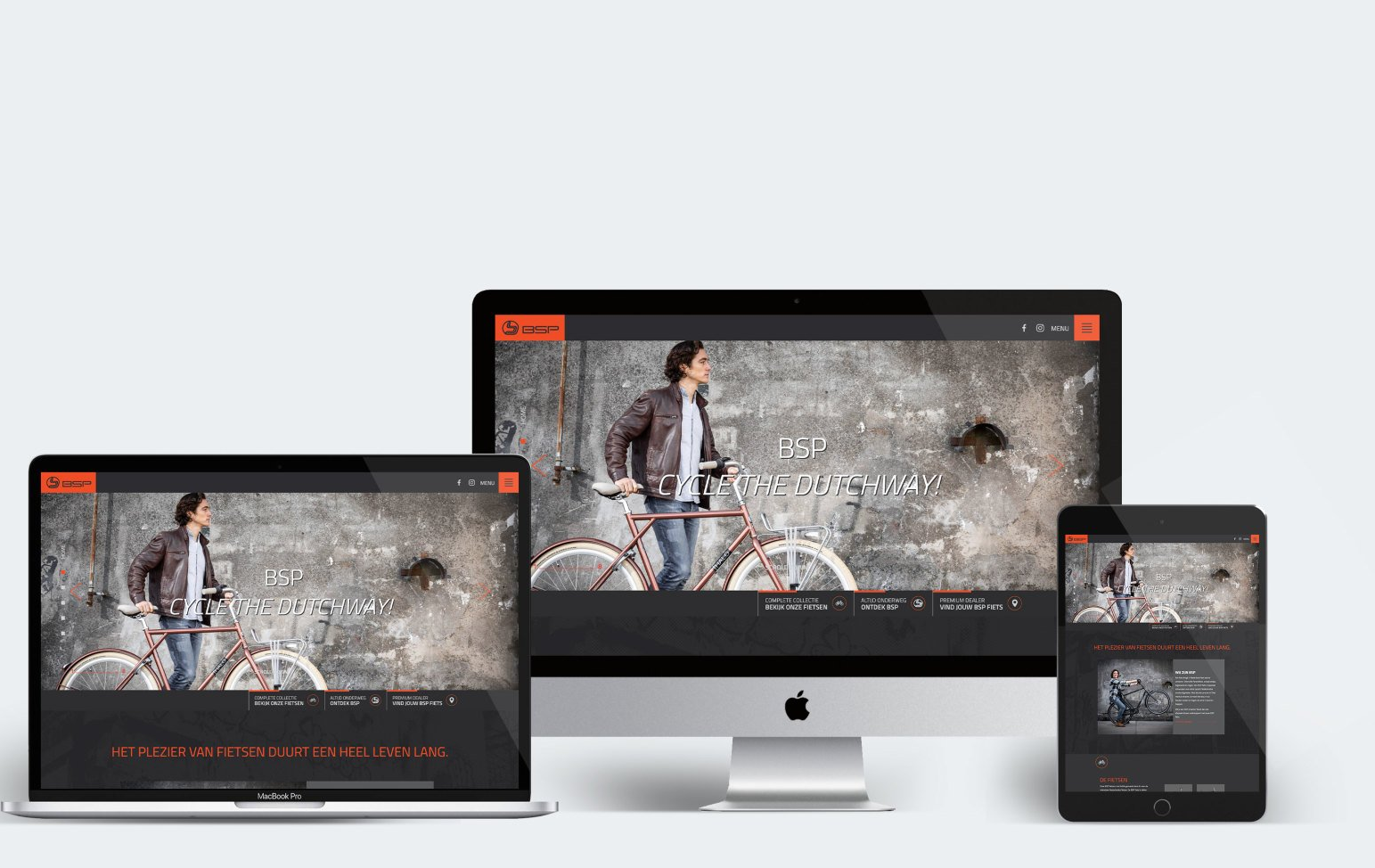 Responsieve website die op laptop-, desktop- en tabletschermen wordt weergegeven, met een afbeelding van een wielrenner als held.