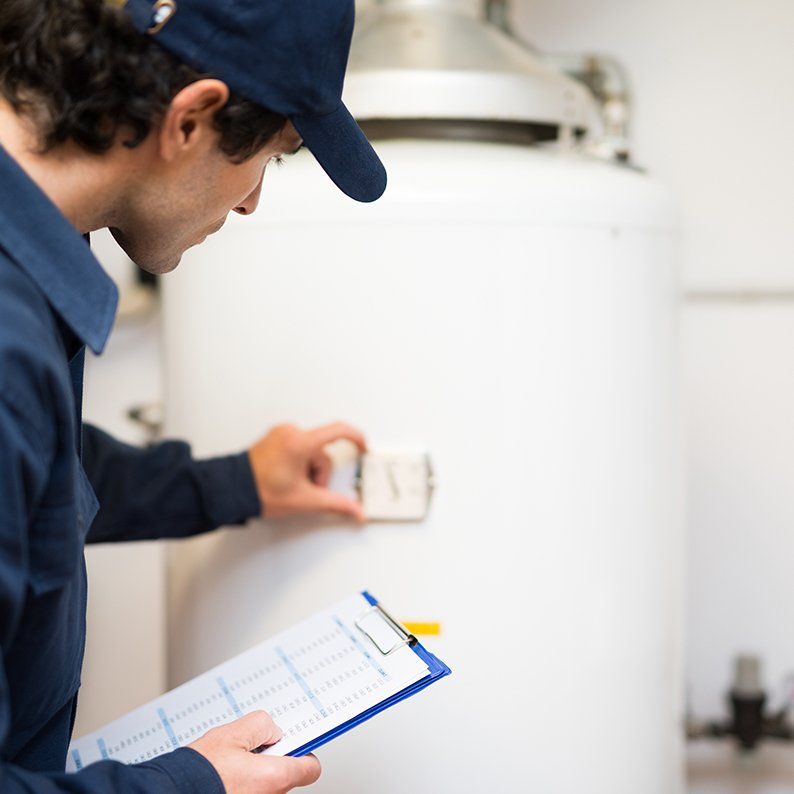 HVAC technician checking up on water heater