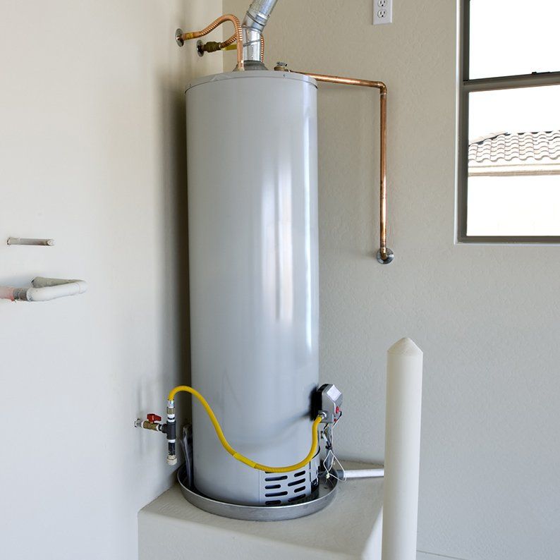 White water heater in boiler room of a residential home