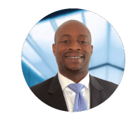 A man in a suit and tie is smiling in a circle.