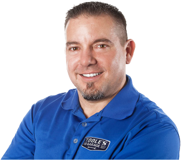 A man wearing a blue shirt that says tools on it