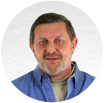 A man with a beard is wearing a blue shirt