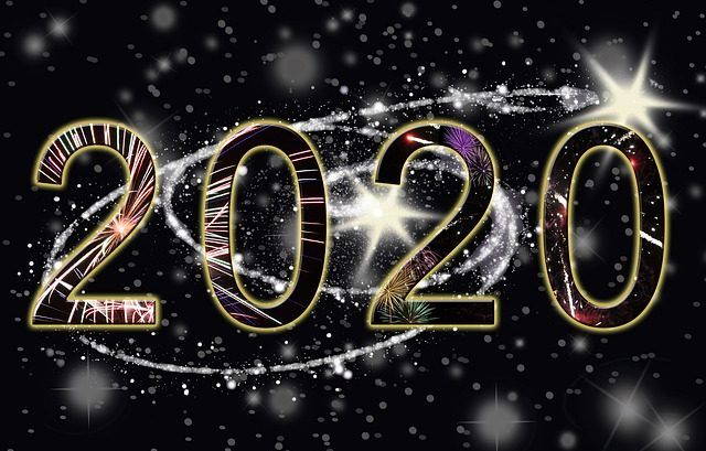 The number 2020 is surrounded by fireworks and stars on a black background.