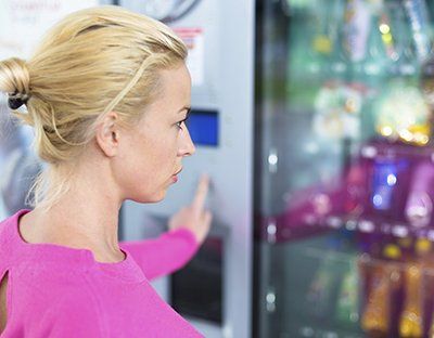 Woman at vending machine
