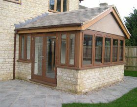 conservatory with wooden frame by RTB construction in Cheltenham