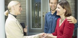 woman shaking hands with a couple