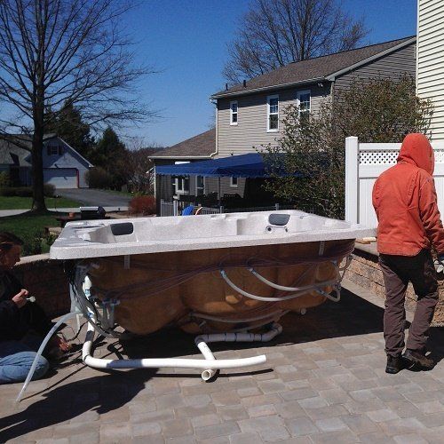 A worker providing a hot tub repairs in Reading, PA