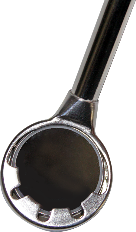 Close-up of a chrome ratchet wrench head. The head has a circular opening with inner teeth and a curved handle.