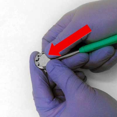 Push mirror coin forward until it clicks into place securely