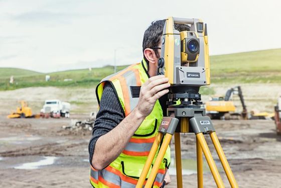 GPS, Total Station and Prism Lined Up in a Field - Commercial Land Surveyors in Manchester, NH GPS, Total Station and Prism Lined Up in a Field - Commercial Land Surveyors in Manchester, NH