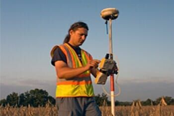 Land Surveyor working with GPS. - Land Development & Planning Engineers in Manchester, NH Land Surveyor working with GPS. - Land Development & Planning Engineers in Manchester, NH