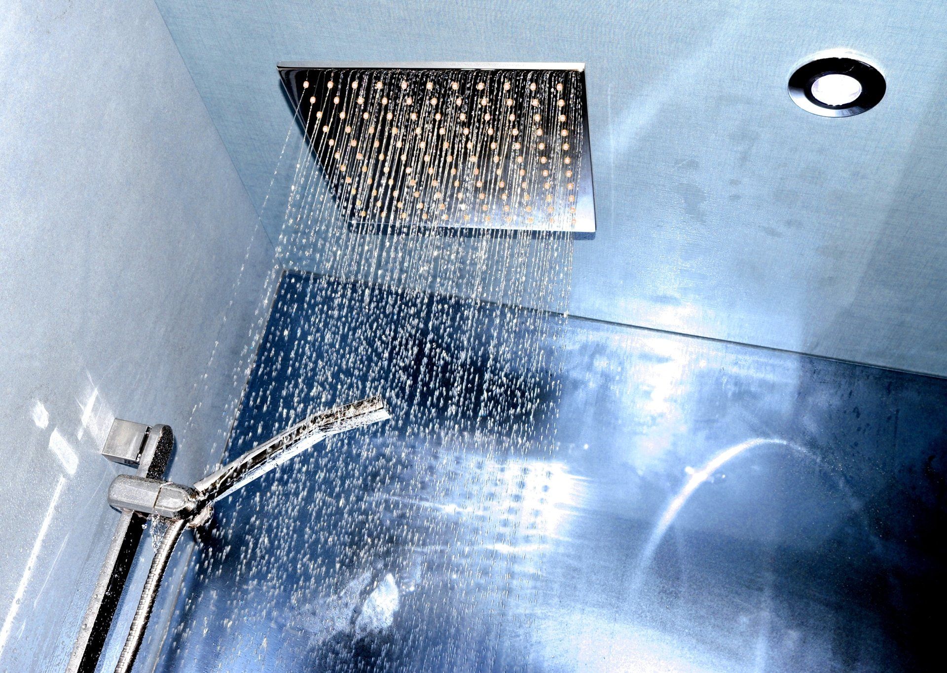 A shower head with water coming out of it