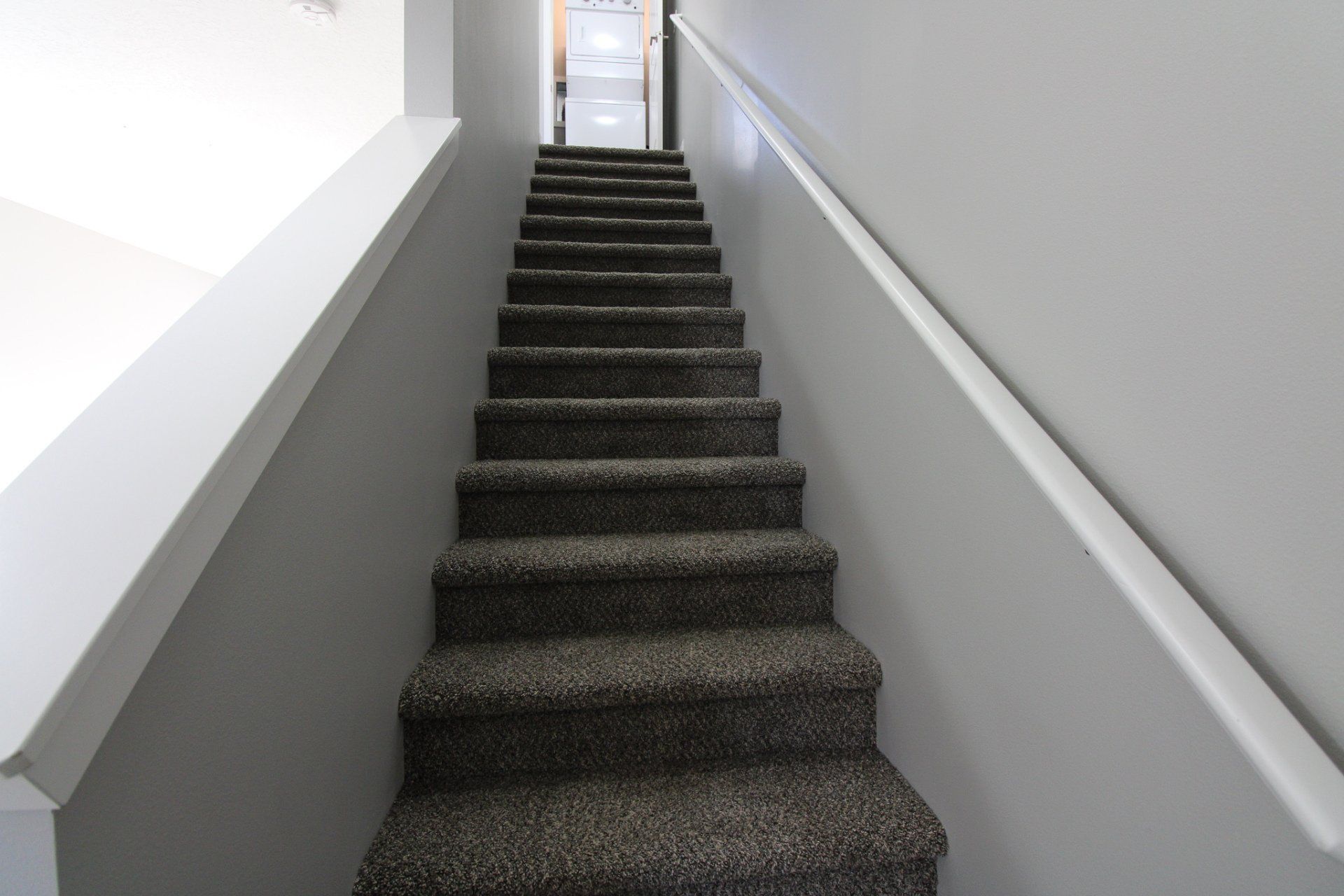 A set of stairs leading up to the second floor of a house.