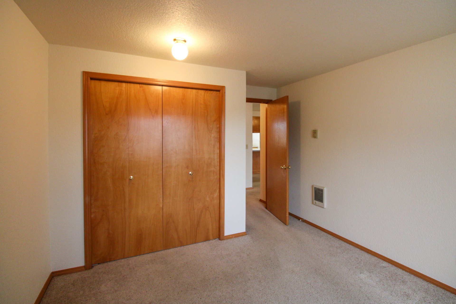 There is a large closet in the middle of the room.