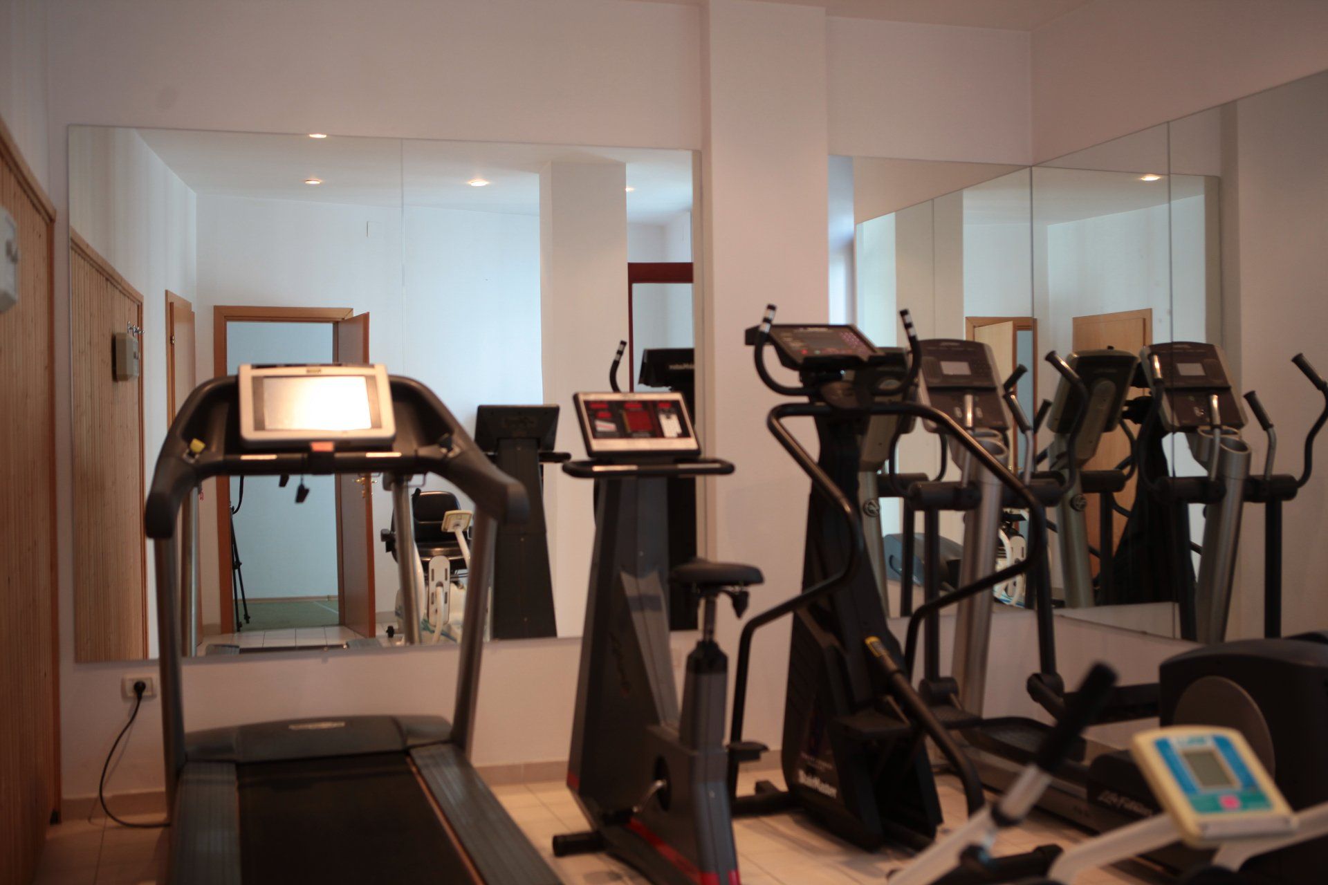 A gym with treadmills and exercise bikes