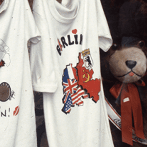 Bear with ribbon and printed shirts