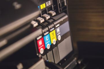 A close up of ink cartridges of a uv printer