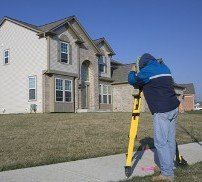 Man in Front of Home, Topographical Surveys in Burnsville, NC Man in Front of Home, Topographical Surveys in Burnsville, NC