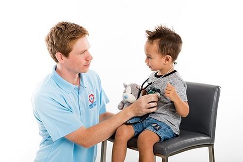 Professional taking care of the young kid