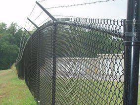 Fence with Barbed Wires — Greenville, SC — Pioneer Fence in Greenville
