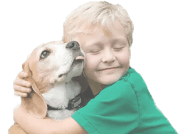 Blond child hugging a beagle dog; dog's tongue out, both with eyes closed, expressing affection.