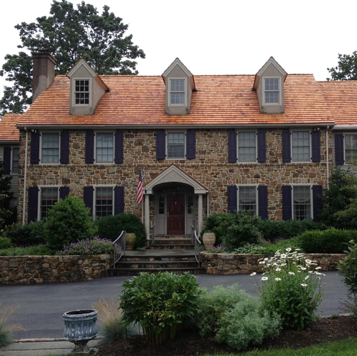 Worker Hand Fixing Roof — Narberth, PA — Scheinfield Contractors