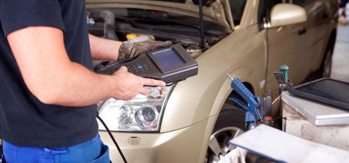 Engineer doing the diagnostics on the car