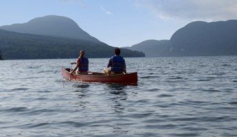 Canoeing on Lake Willoughby Canoeing Couple on Lake Willoughby in Northern Vermont