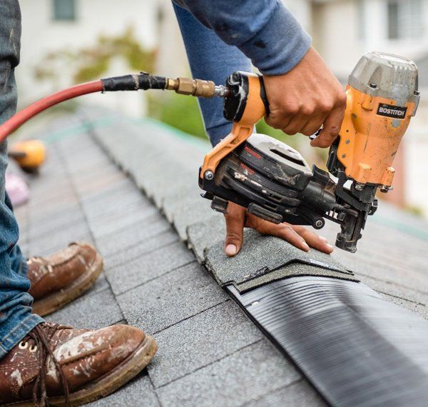 Professional worker installing a new roof for the residential house — Corpus Christi, TX — Gill Roofing Co Inc Professional worker installing a new roof for the residential house — Corpus Christi, TX — Gill Roofing Co Inc