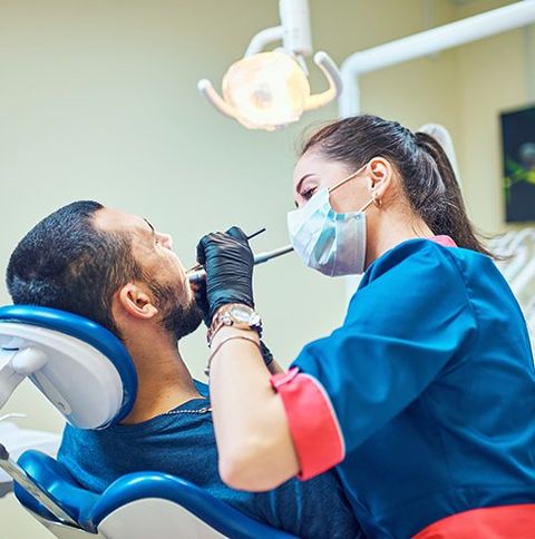 Dentist at Work on a Patient in Clinic — Empire, MI — Empire Family Dental