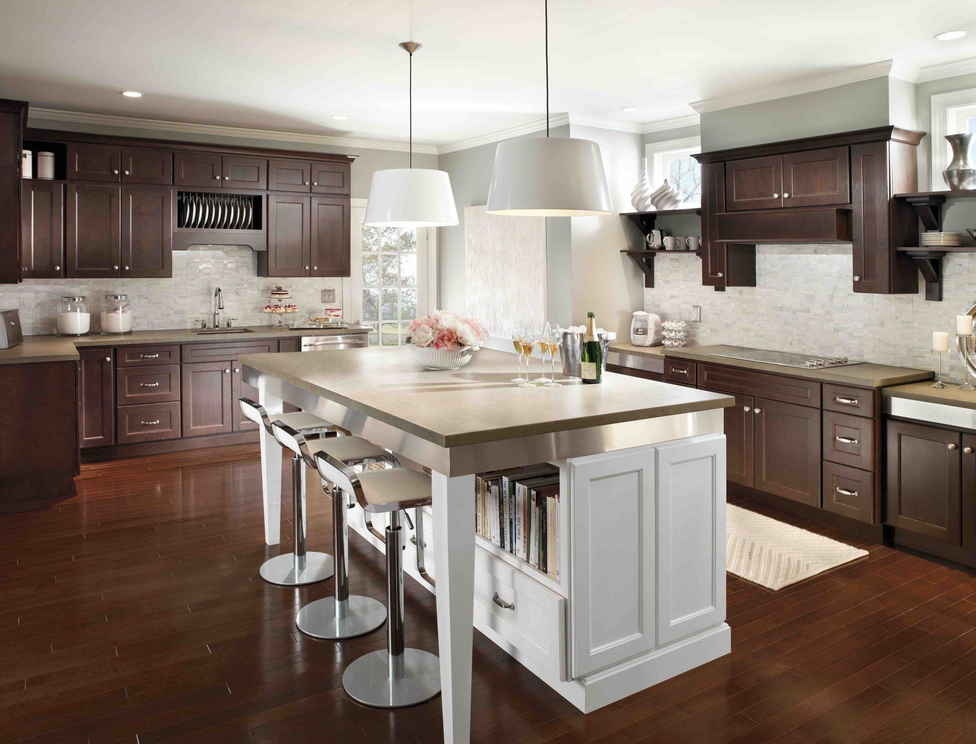 A kitchen with a large island in the middle of it.
