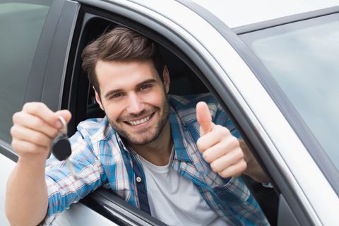 Master Keying — Man Inside a Car Holding a Key in Philadelphia, PA Master Keying — Man Inside a Car Holding a Key in Philadelphia, PA