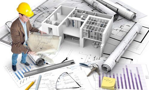View of an architect checking the structure drawings 