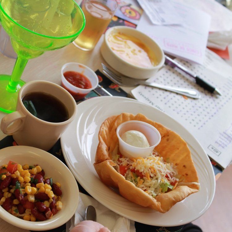 Taco salad and condiments.