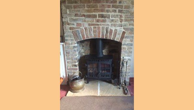 Completion of project including new log burner and building works