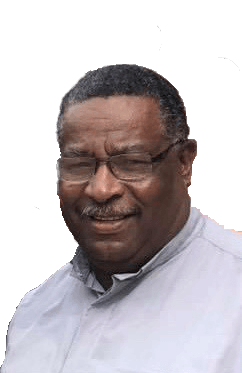 Man with glasses smiling, wearing a light-colored collared shirt, against a white background.