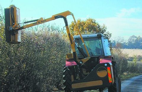 Tractor Trimming hedge