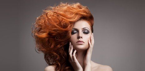 woman with coloured hair and eye makeup