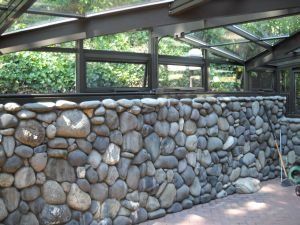 Sunroom with interior stone wall Sunroom with interior stone wall
