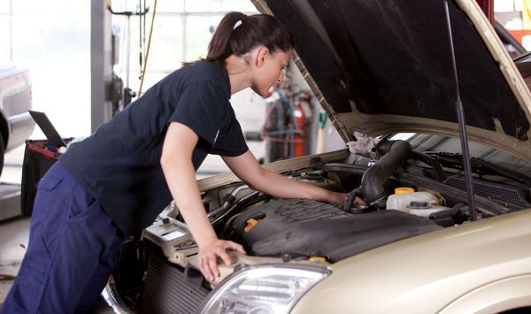 Mechanic performs auto service
